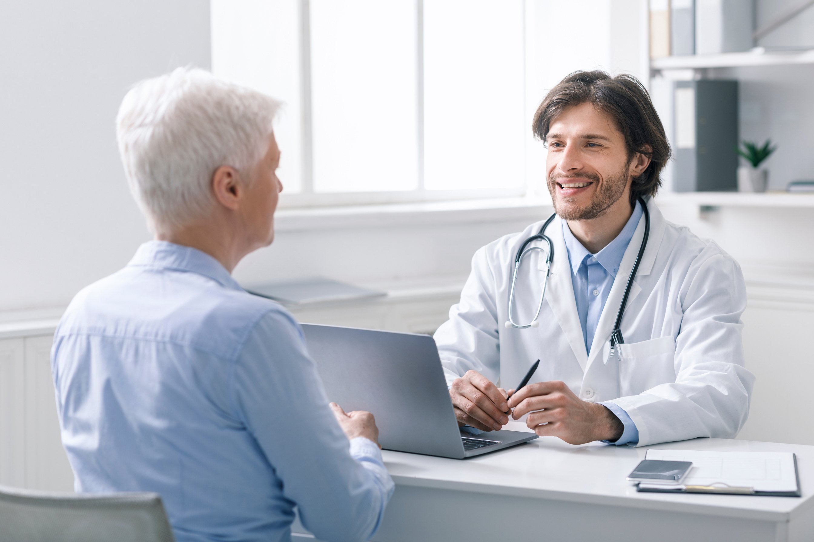 Senior patient at appointment of geriatrician doctor