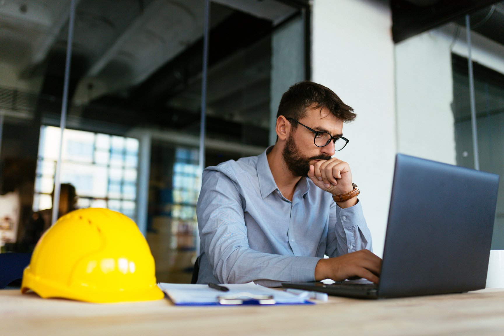 Engineer looking at laptop